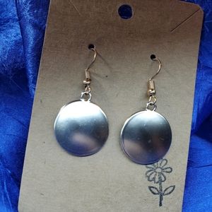 Dangling Smooth, curved Gold button earrings.